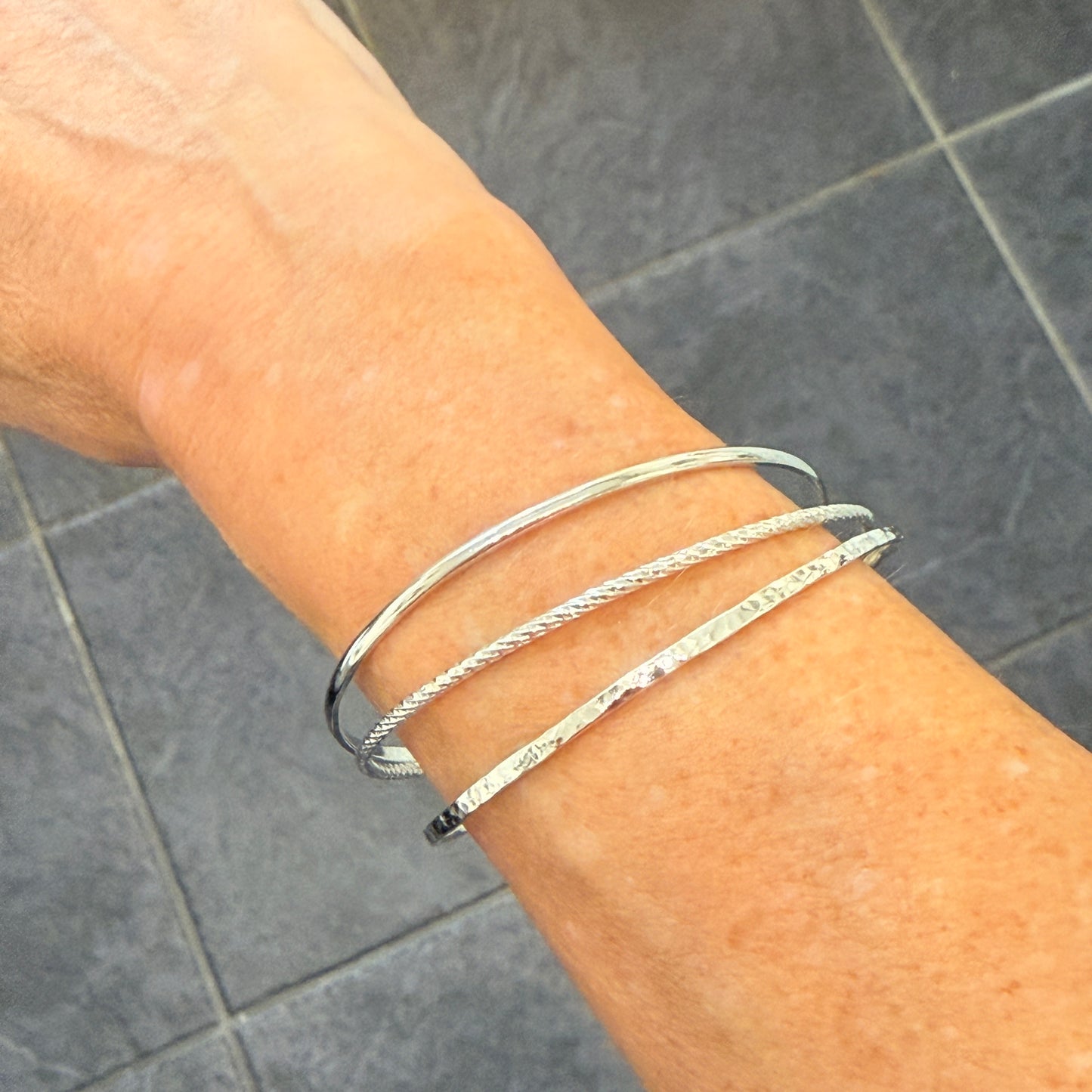 Triple Set of Bangles with Floating Diamond Cut Rings